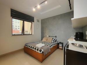 Studio com piscina no Casa Mauá客房内的一张或多张床位