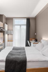 Giường trong phòng chung tại Best Western Plus Hotel Zürcherhof