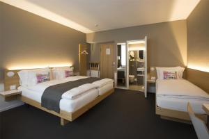 Giường trong phòng chung tại Best Western Plus Hotel Zürcherhof
