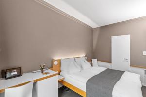 Giường trong phòng chung tại Best Western Plus Hotel Zürcherhof