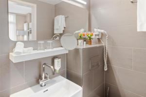 Phòng tắm tại Best Western Plus Hotel Zürcherhof