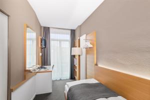 Giường trong phòng chung tại Best Western Plus Hotel Zürcherhof