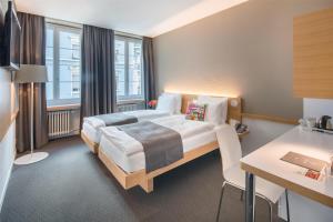 Giường trong phòng chung tại Best Western Plus Hotel Zürcherhof