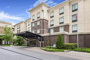 a rendering of the front of a hotel at Homewood Suites by Hilton Huntsville-Downtown in Huntsville