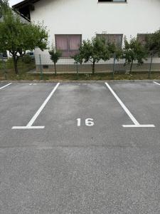 a parking lot with the number written on it at Andro studio apartment in Ljubljana