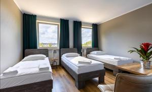Postel nebo postele na pokoji v ubytování Hotel Zielonki