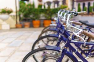 a row of blue bikes parked next to each other at NH Collection Buenos Aires Jousten in Buenos Aires