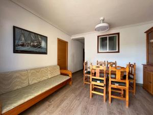 a living room with a couch and a table and chairs at Casablanca in Miramar