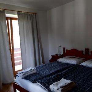 Postel nebo postele na pokoji v ubytování DOLOMITI DA VIVERE