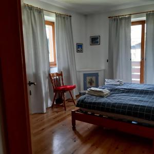 Postel nebo postele na pokoji v ubytování DOLOMITI DA VIVERE