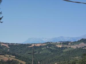 a view of a valley with mountains in the background at Casale San Martino Agriturismo Bio in SantʼAngelo in Pontano +71 photos