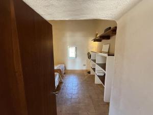 a hallway with a room with a bed and a door at Ca Na Vilda in Sant Ferran de Ses Roques +32 photos