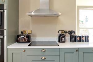 a kitchen with a counter top with a toaster and appliances at The Scarborough Suite in Marske