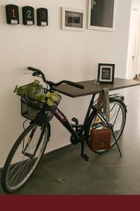 a bike parked in front of a table at Vila Green by Plaiul GreenBike in Deva