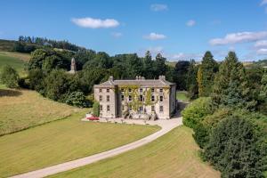 an aerial view of an old house in a field at The Scarborough Suite in Marske