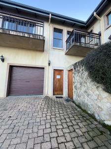 a house with two garage doors and a brick driveway at Geust House 4288 in Bethlehem +5 photos