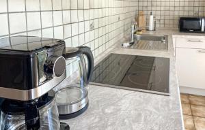 a kitchen counter with a coffee maker and a sink at Ferienhaus 5 In Thalfang in Thalfang