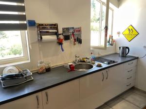 a kitchen with a sink and a counter top at Mountain View in Bar
