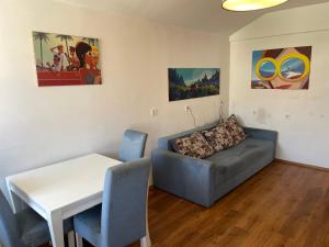 a living room with a couch and a table at Mountain View in Bar