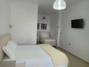 Postel nebo postele na pokoji v ubytování Hotel Relax Dhermi