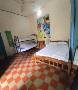 Postel nebo postele na pokoji v ubytování White Rabbit Hostal