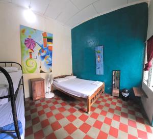 Postel nebo postele na pokoji v ubytování White Rabbit Hostal