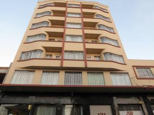 a tall apartment building with windows at Hotel Ponta Grossa São Marcos in Ponta Grossa +70 photos
