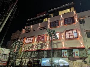 a building with lights on the side of it at Haritwal Guest House in Varanasi +31 photos
