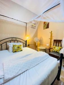 a bedroom with a bed in a tent at Shambani House in Arusha