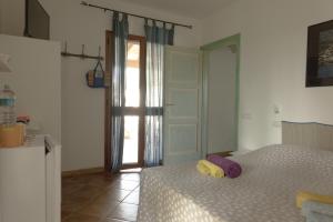 Postel nebo postele na pokoji v ubytování "Il Piccolo Principe" - Residenze Gattopardu