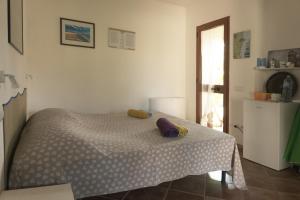 Postel nebo postele na pokoji v ubytování "Il Piccolo Principe" - Residenze Gattopardu + 4 fotografie