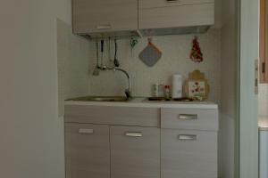 Kuchyň nebo kuchyňský kout v ubytování "Il Piccolo Principe" - Residenze Gattopardu