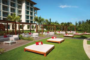 a rendering of a hotel patio with couches and tables at Breathless Montego Bay Adults Only - All Inclusive in Montego Bay