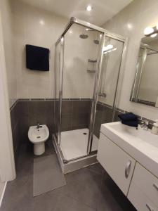 a bathroom with a shower and a toilet and a sink at Costa Adeje Fañabé Beach in Adeje