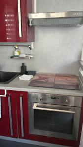 a kitchen with a stove and a counter top at Studio lumineux avec balcon à Nice in Nice +11 photos