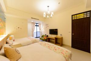 Letto o letti in una camera di BeautyFlower Cottage
