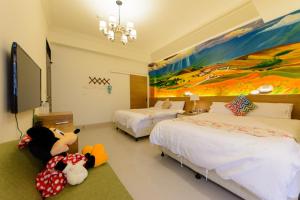 Letto o letti in una camera di BeautyFlower Cottage