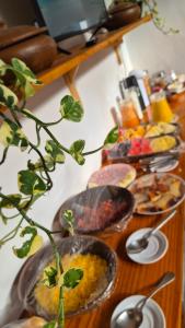 a table with many plates of food on it at La Famiile in Icapuí