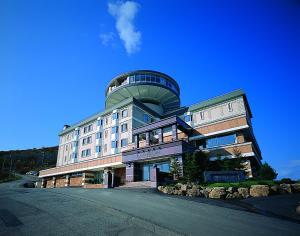 a building with a dome on top of it at Hotel Neu Schloss Otaru in Otaru