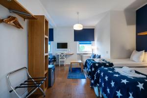 Postel nebo postele na pokoji v ubytování Port Hotel