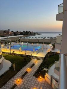 a view of a swimming pool next to the ocean at Scandic Resort in Hurghada, EGYPT in Hurghada