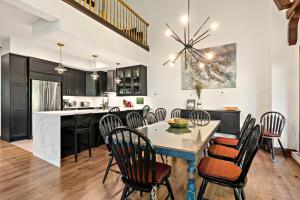 a kitchen and dining room with a table and chairs at Tremblant Prestige - Manoir 108-2 in Mont-Tremblant +23 photos