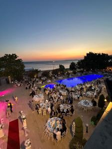 an overhead view of a group of people sitting at tables at Grand Vuslat Erdek in Erdek +95 photos