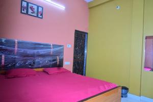 Ένα ή περισσότερα κρεβάτια σε δωμάτιο στο Aagya Guest House