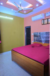 Ένα ή περισσότερα κρεβάτια σε δωμάτιο στο Aagya Guest House