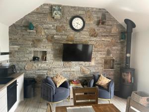 TV o dispositivi per l'intrattenimento presso Dun Aengus Cottage on the Cliffs of Moher