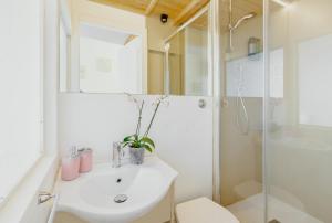 a bathroom with a sink and a shower at 21 Duomo - Camera con bagno privato in Florence +3 photos