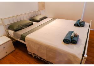 Ένα ή περισσότερα κρεβάτια σε δωμάτιο στο Spiral-Loft, Santo Apartment