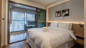 Cama ou camas em um quarto em 360 Ambience Vila Mariana