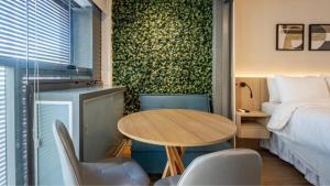 Cama ou camas em um quarto em 360 Ambience Vila Mariana